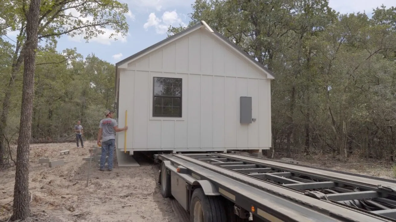 Cabin being positioned at site